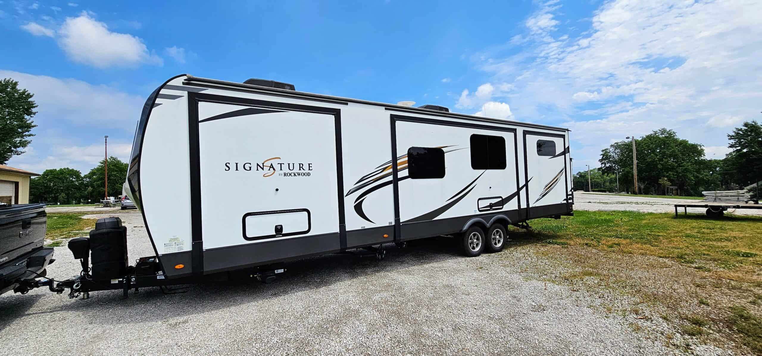 Rockwood Signature RV attached to a truck.