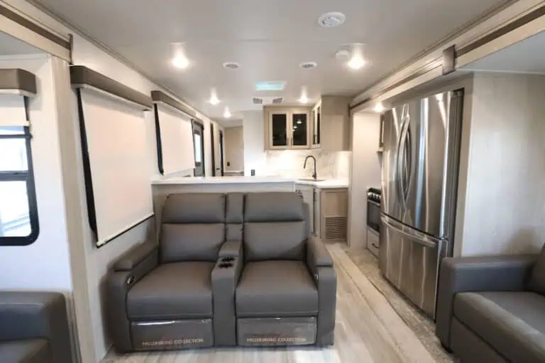 Modern RV interior with kitchen and seating area