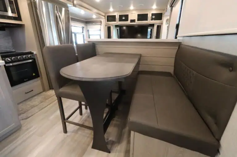 RV dining area with table and seats