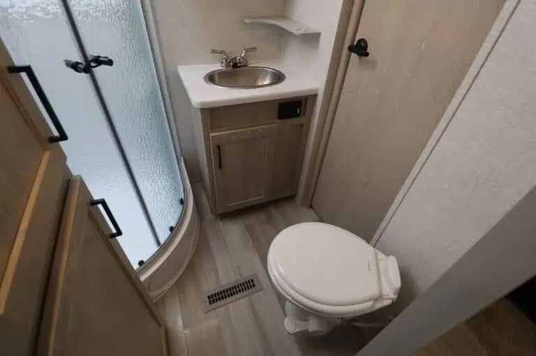 Small bathroom with shower, sink, and toilet