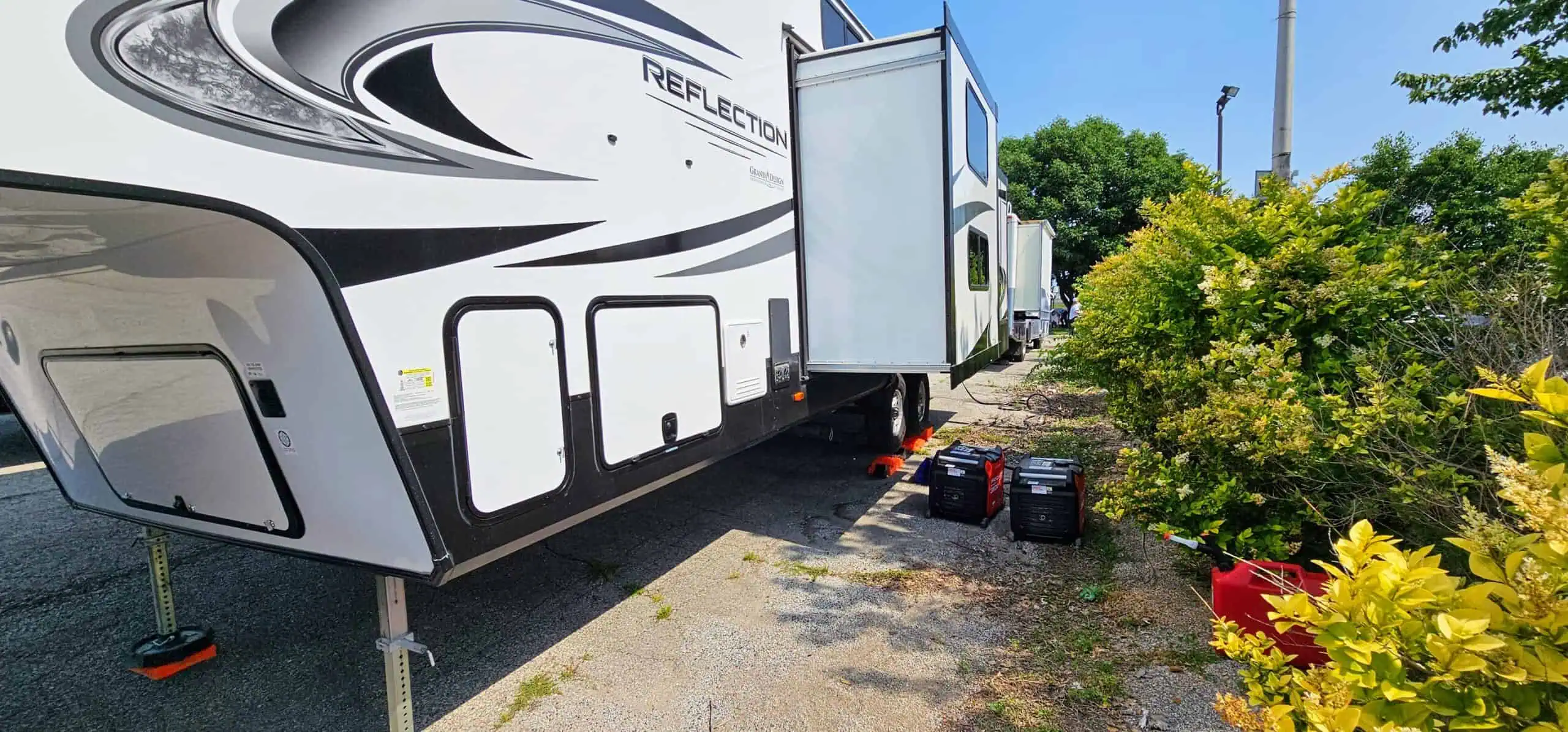 Recreational vehicle parked with generators outside