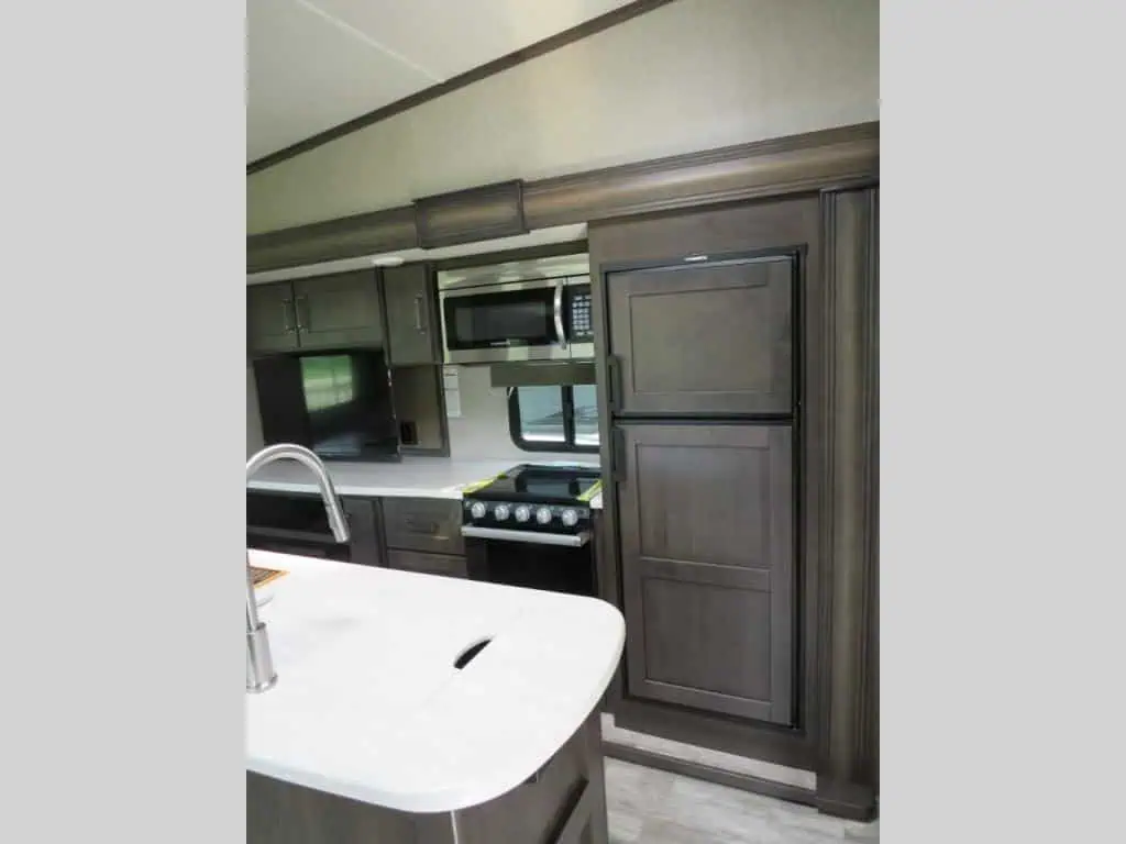 Modern RV kitchen with appliances and countertop