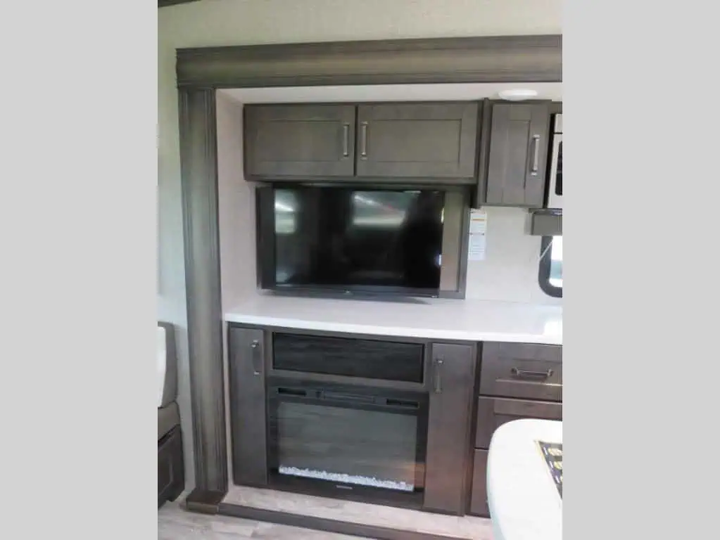 RV interior with TV and fireplace