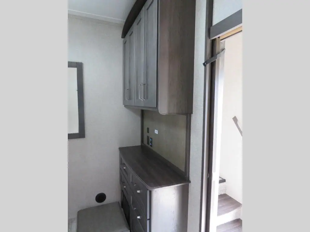 Wooden cabinet and drawers in a small room